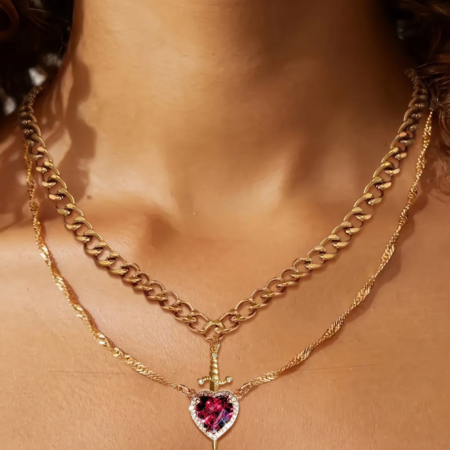 Model wearing Heart and Sword Necklace for a stylish jewelry look